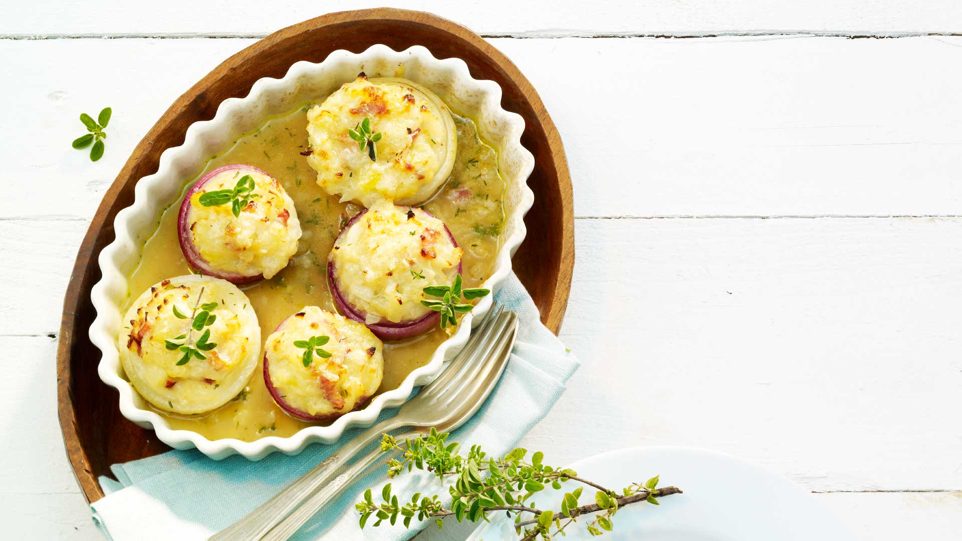 Onions filled with potatoes and bacon - Emmentaler AOP Switzerland