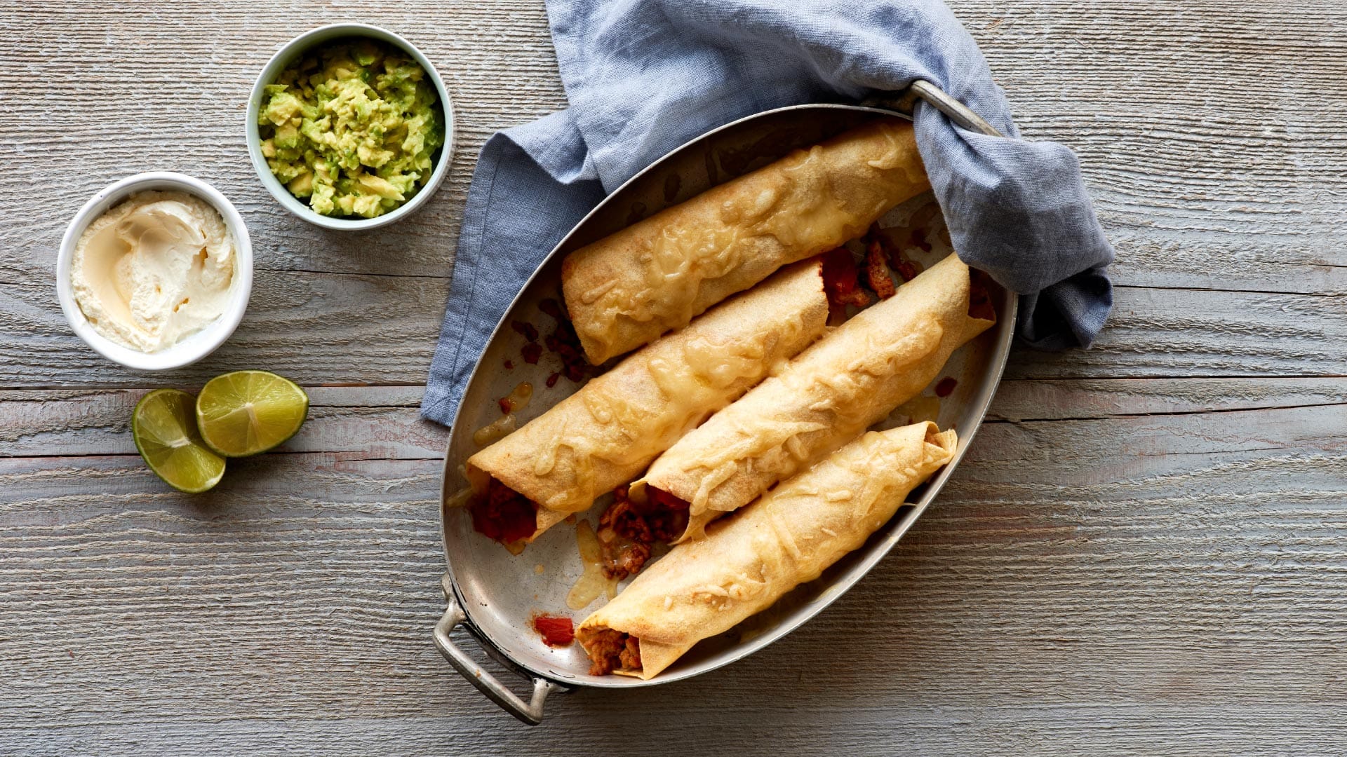 Enchiladas with Chicken, Guacamole and Crème fraiche - Emmentaler AOP Switzerland